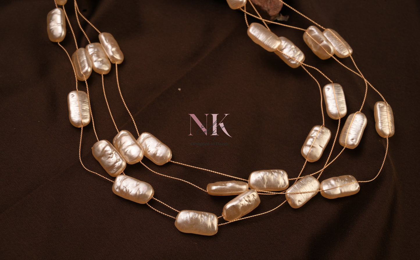 Lustrous Pearl Cascade Neckline