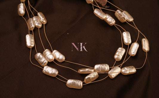 Lustrous Pearl Cascade Neckline