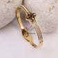 Regal Clover Black Background with Gold Bracelet