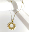 Golden Aura Spiked Circle Pendant Neckline